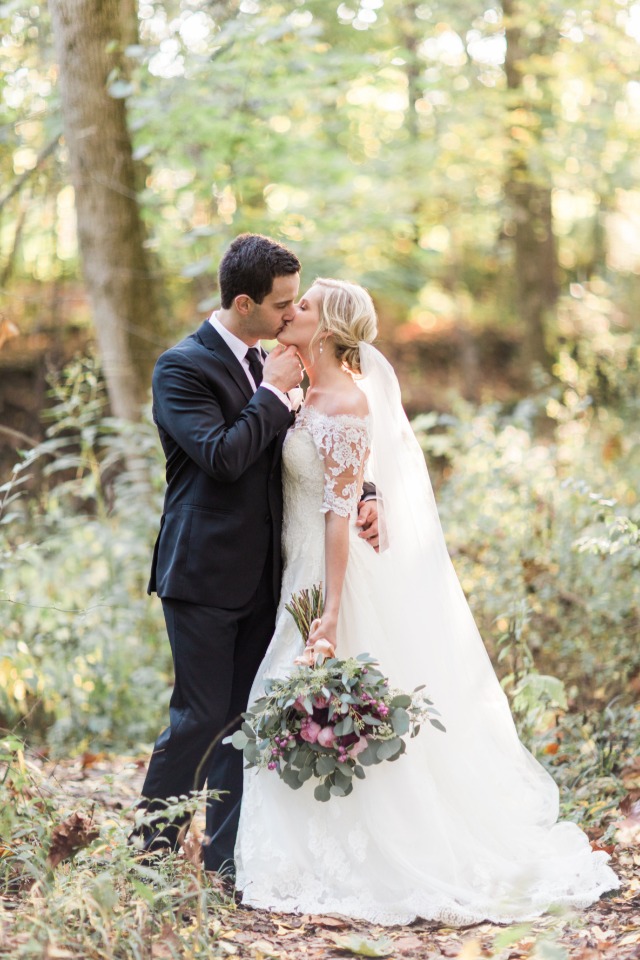 bride and groom wedding kiss at golden hour