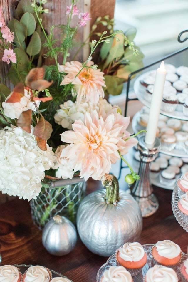 silver pumpkin and floral cake table decor