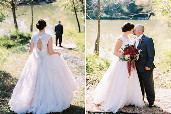Happy wedding couple kisses outdoors at first look