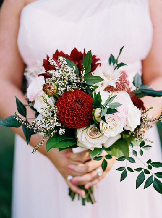 Elegant bridal bouquet with rich red and soft white flowers