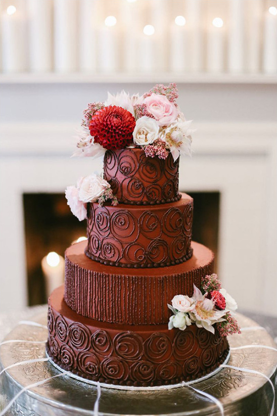 Decadent chocolate tiered cake with elegant floral decor