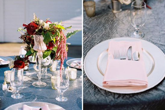 Elegant table setting with centerpiece and pink napkin