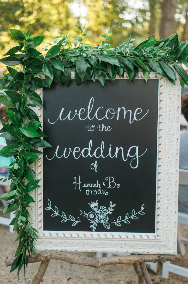 chalkboard wedding welcome sign with garland
