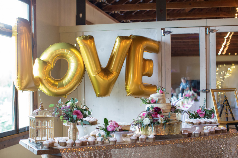 gold love balloons for wedding dessert table