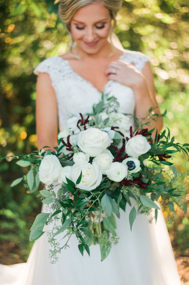 white wedding roses bouquet with ranunculus and anemone