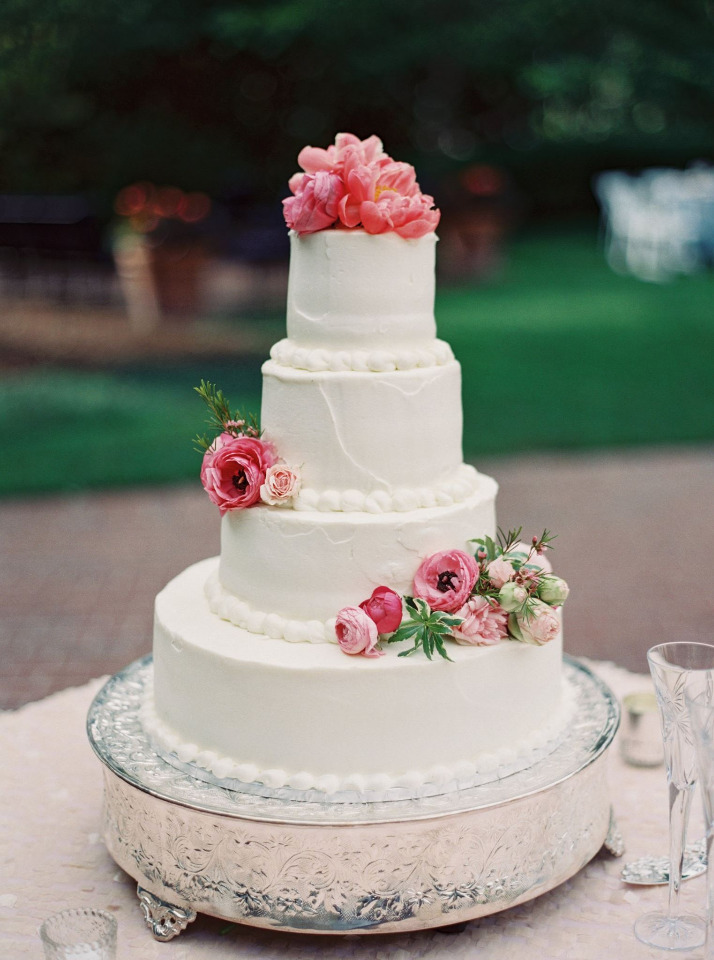 classic white wedding cake with pink flowers