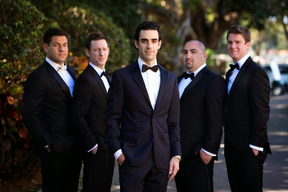 Classic black bow tie look for the groom and his men