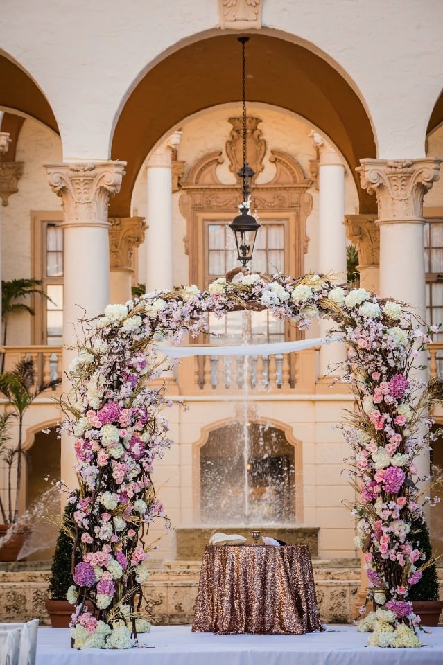 Oversized wedding chuppah covered in flowers