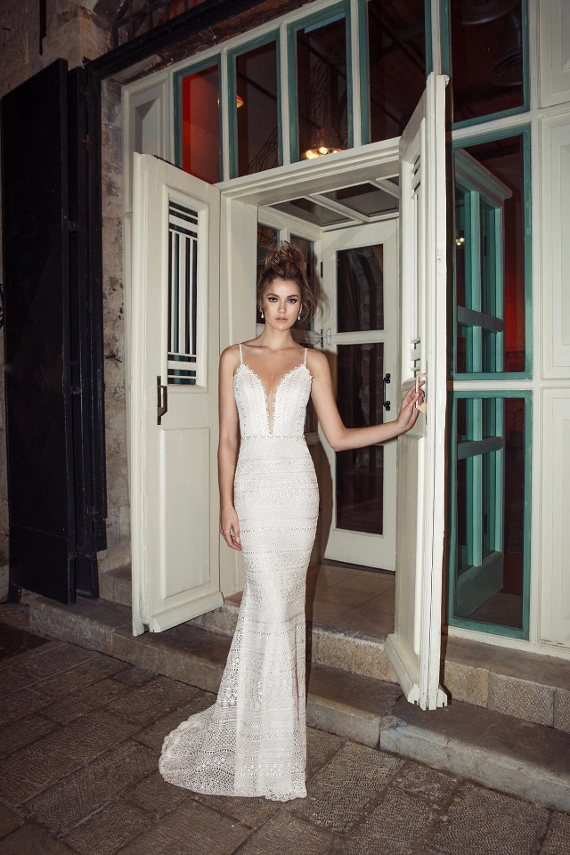 Elegant bride in a stunning white wedding dress at the door