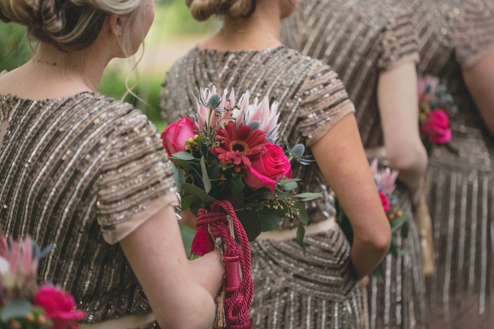 art deco style bridesmaid dresses and pink bouquets