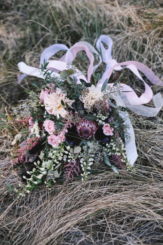 Beautiful wedding bouquet with pink and white ribbon