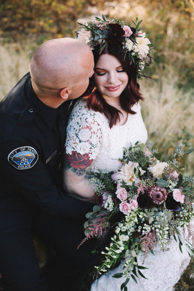 Police officer and bride on their wedding day outdoors