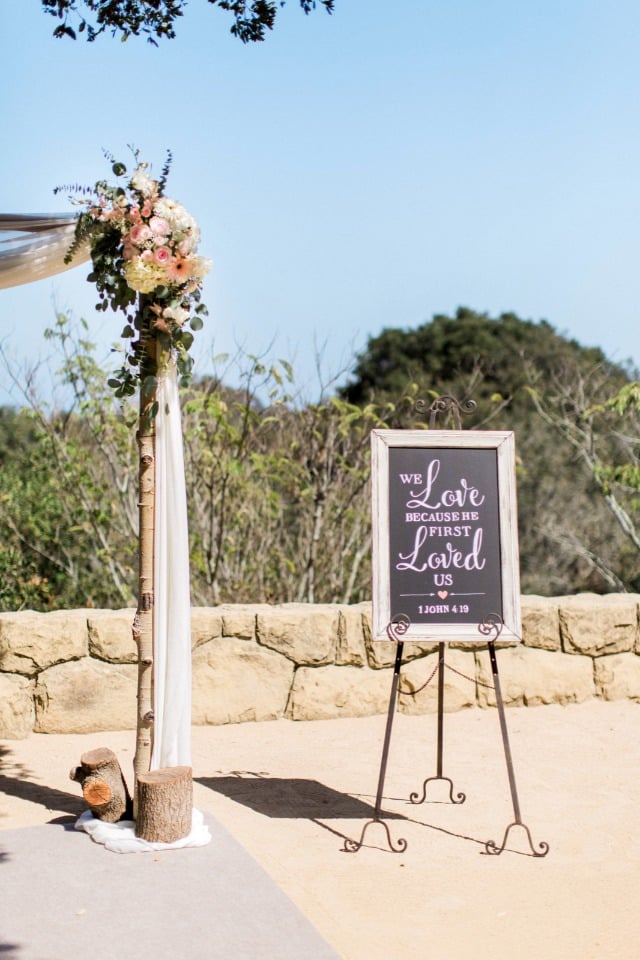 we love because he first loved us wedding ceremony sign