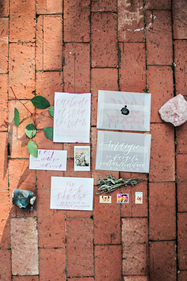 white and pink calligraphy wedding invites