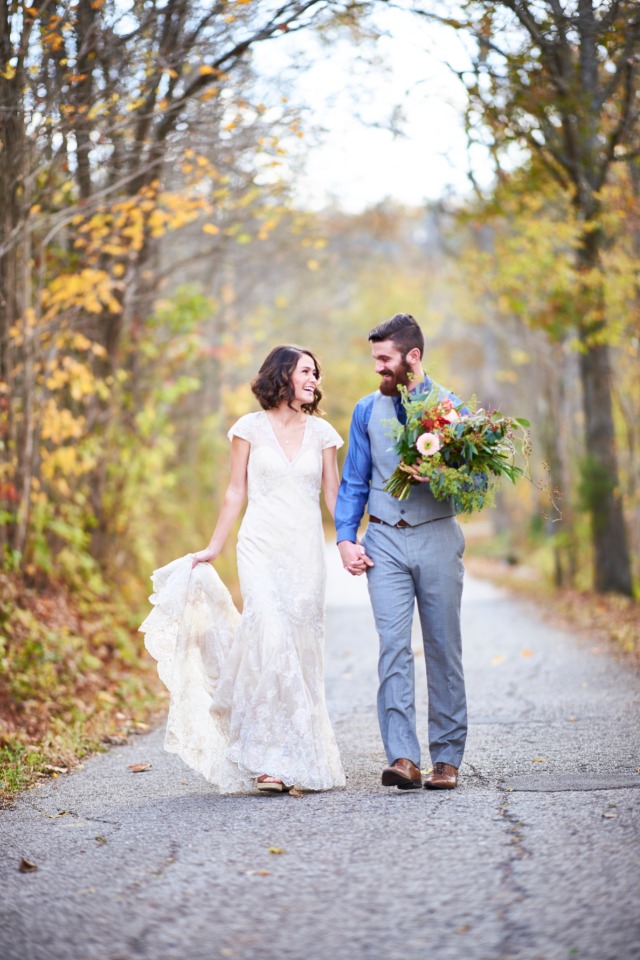 wedding couple taking a walk in the fall