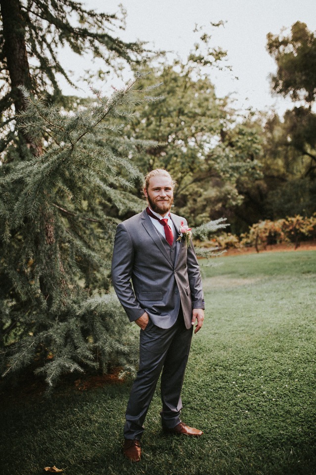 groom in grey and red