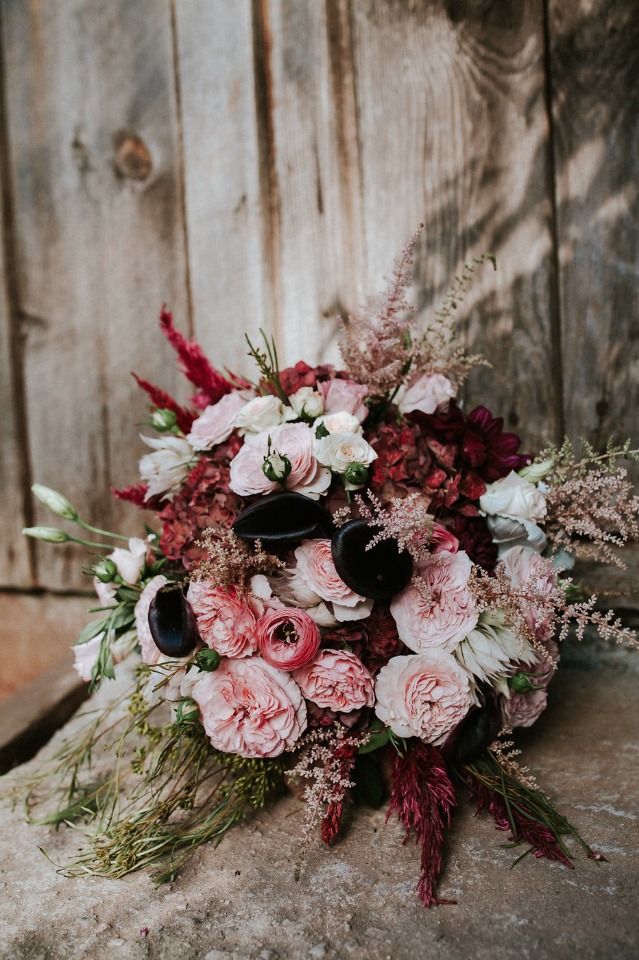 unique red pink and black bouquet