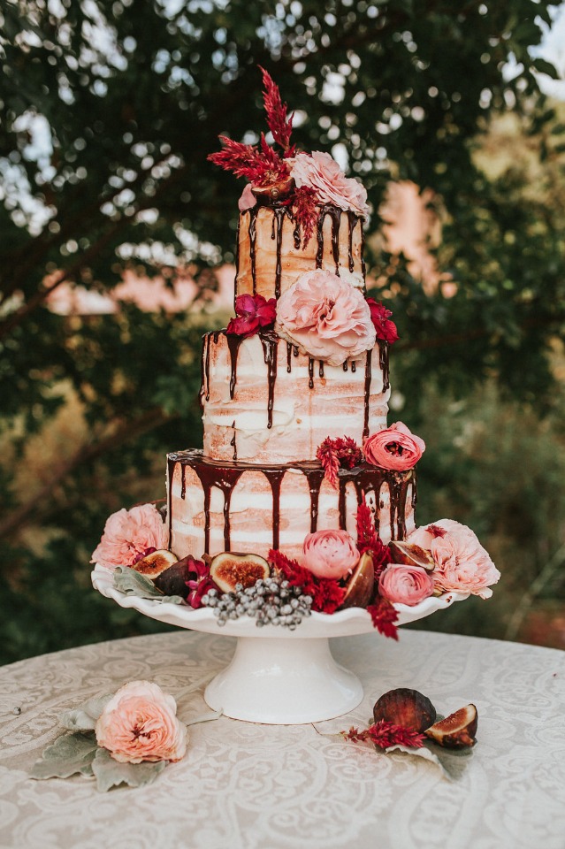 naked wedding cake with chocolate drizzle