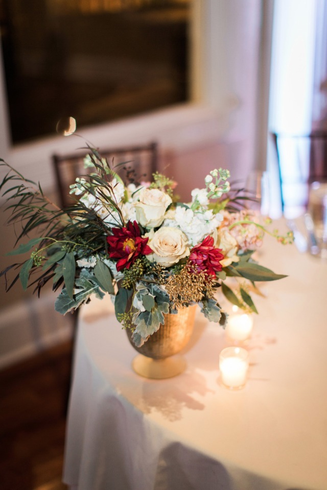 Floral centerpiece in a gold vase