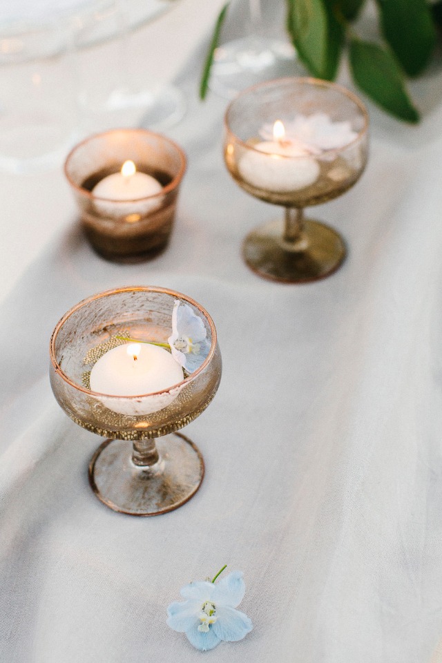 floating votive candles on the table
