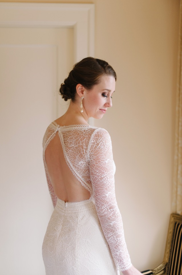 lacy long sleeved and back showcasing wedding dress