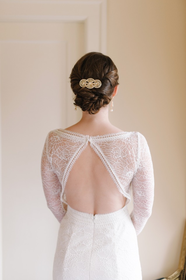 back showcasing wedding dress with long lace sleeves