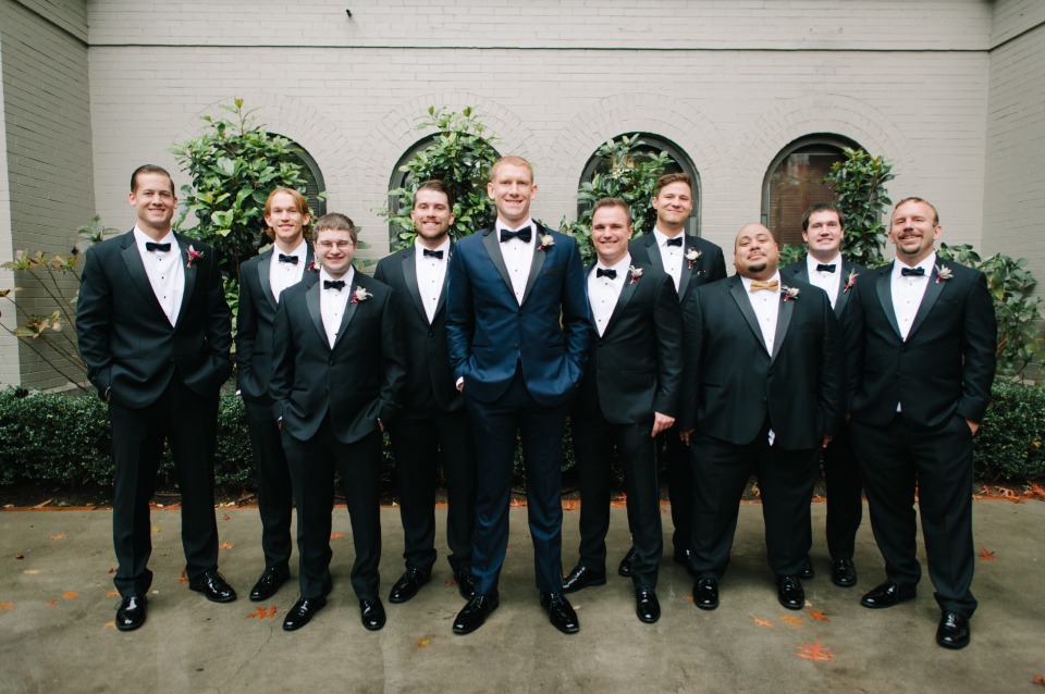 groom in navy and groomsmen in classic tuxedos