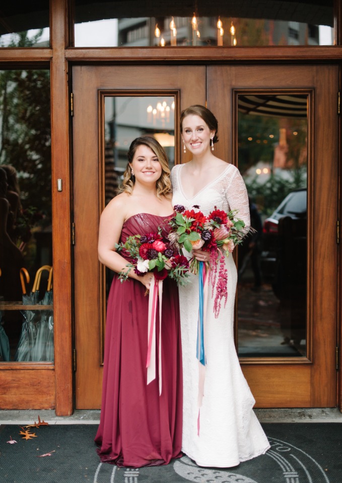 bride and bridesmaid in maroon