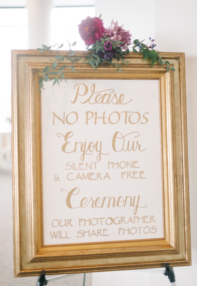 gold framed wedding ceremony sign