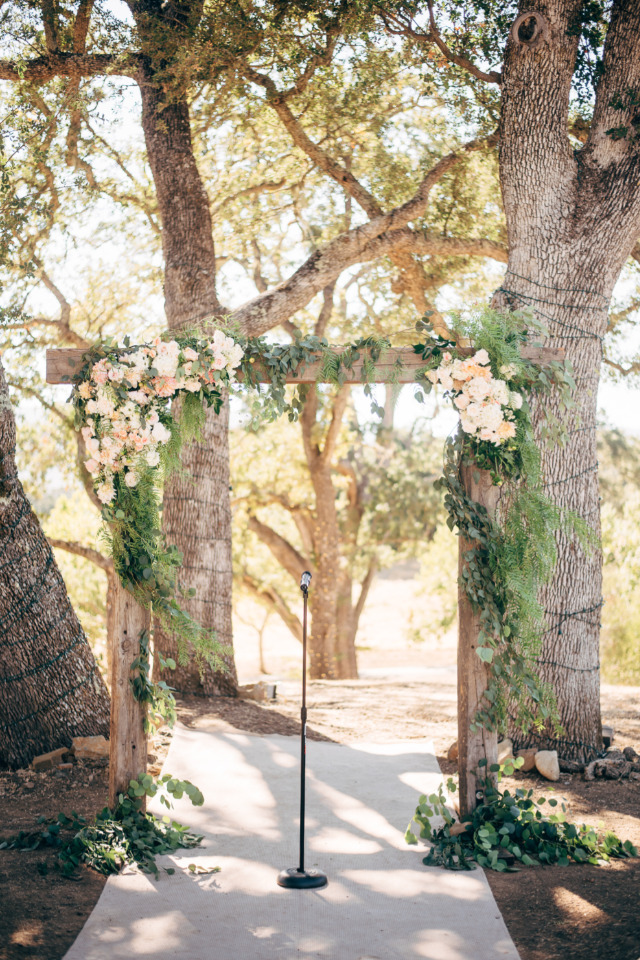 beautiful wood and flower wedding ceremony arch
