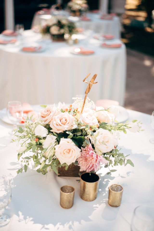 Elegant wedding table setting with floral centerpiece and candles
