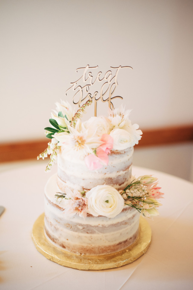 Two tiered cake with flowers and Treat Yourself topper