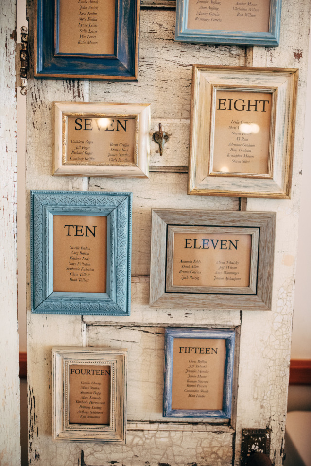 Wedding seating chart with numbers and guest names in frames