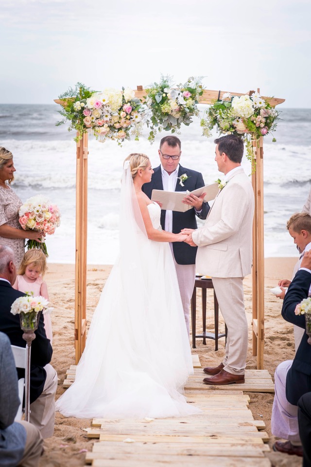 Chic wedding arbor with flowers
