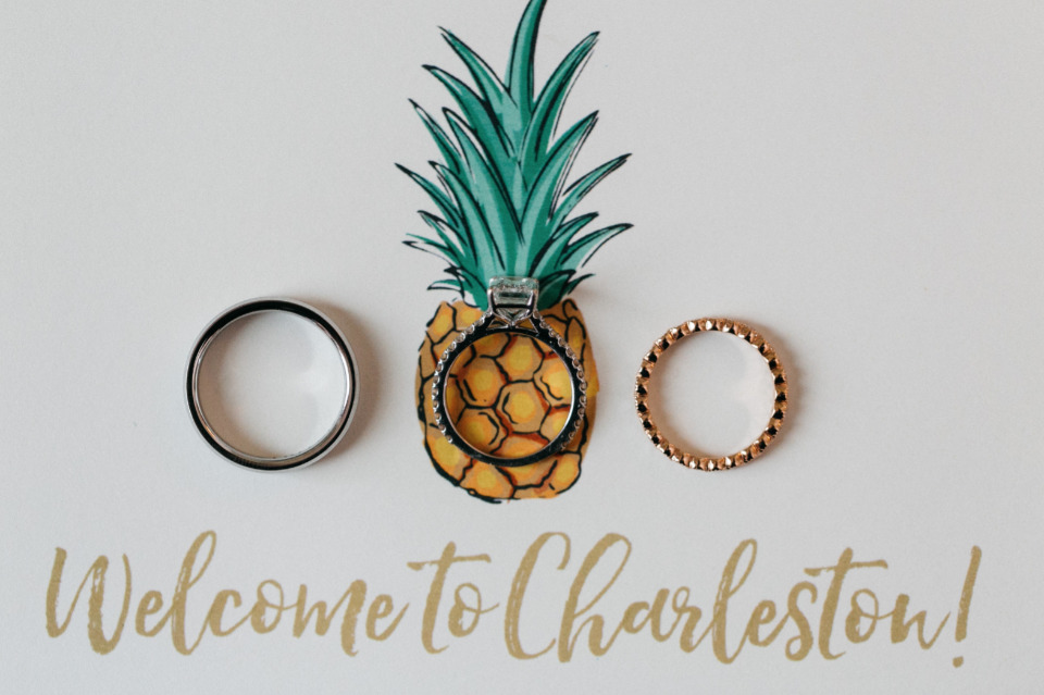 gold pineapple wedding stationery and rings