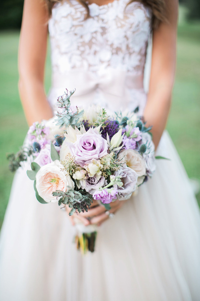 white and purple wedding bouquet with roses
