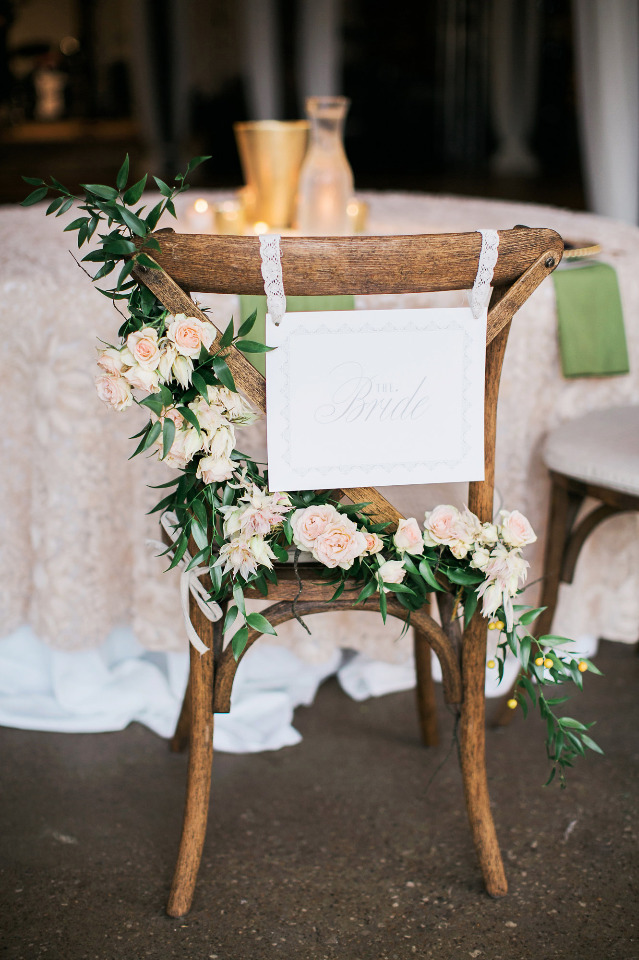wedding bride seat with flowers and sign