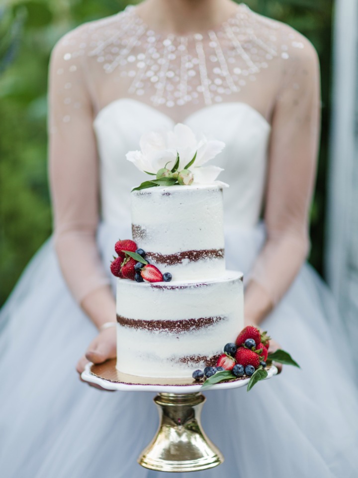 Gorgeous nearly naked cake with fruit and flowers