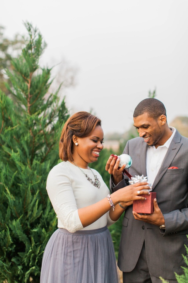 Surprise engagement at a Christmas tree farm