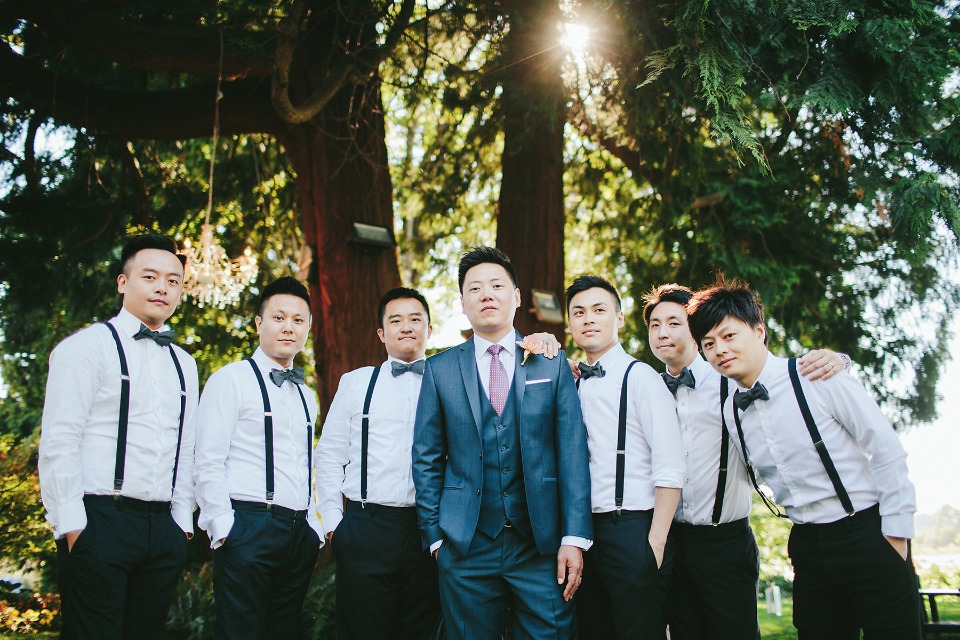 groomsmen in suspenders and bow ties