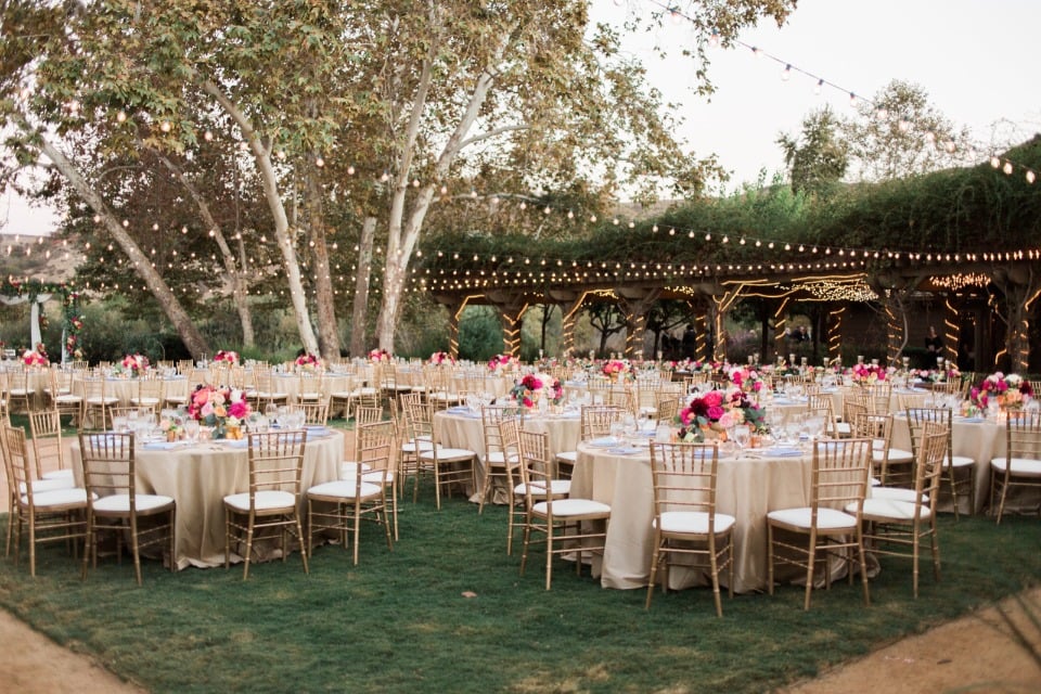 Gorgeous chic outdoor reception with bistro lights