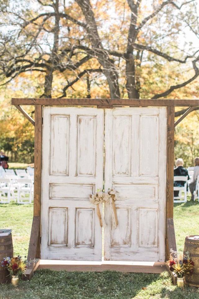 Rustic ceremony entrance with old doors