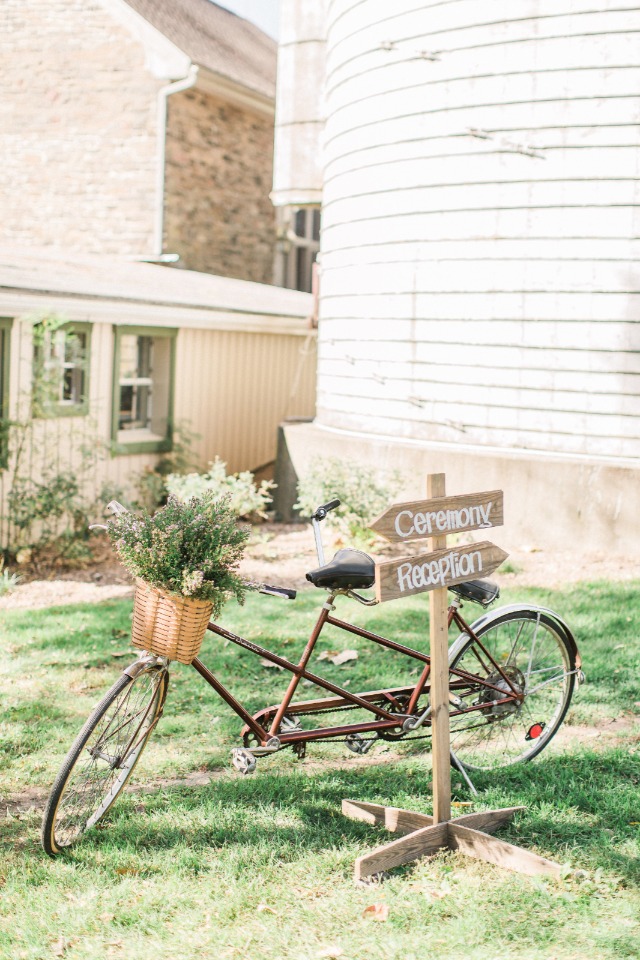 Ceremony and reception signage with vintage tandem bike decor