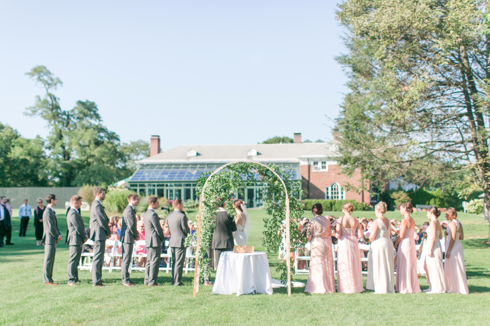 beautiful outdoor wedding ceremony with arch
