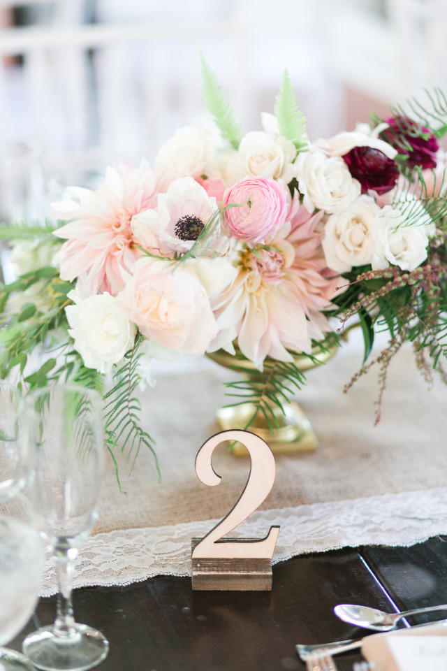 pink and white ranunculus and poppy wedding centerpiece