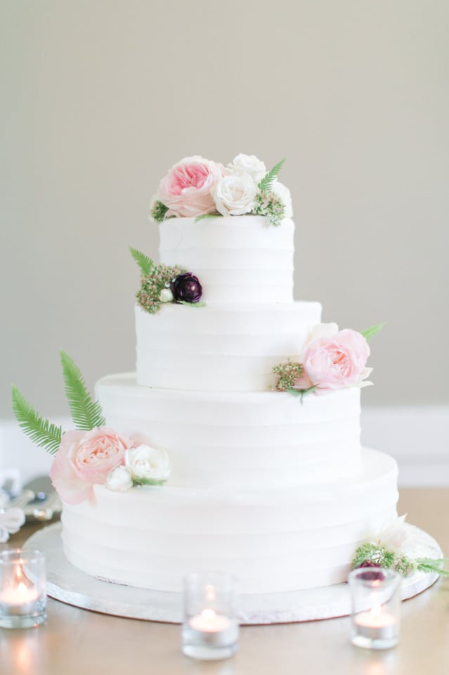 white wedding cake with pink roses