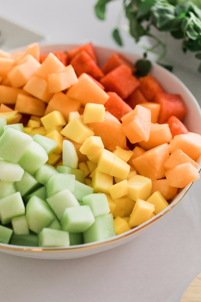 Colorful array of diced fruit arranged in a beautiful bowl for a snack