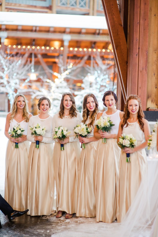 Bridesmaids in champagne colored skirts