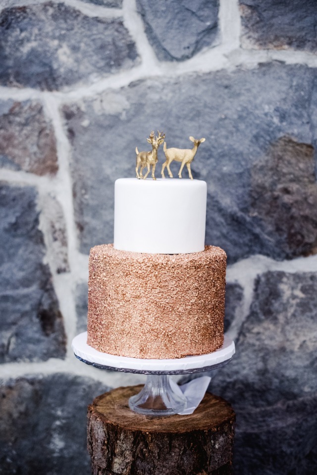 Gold and white cake with deer toppers