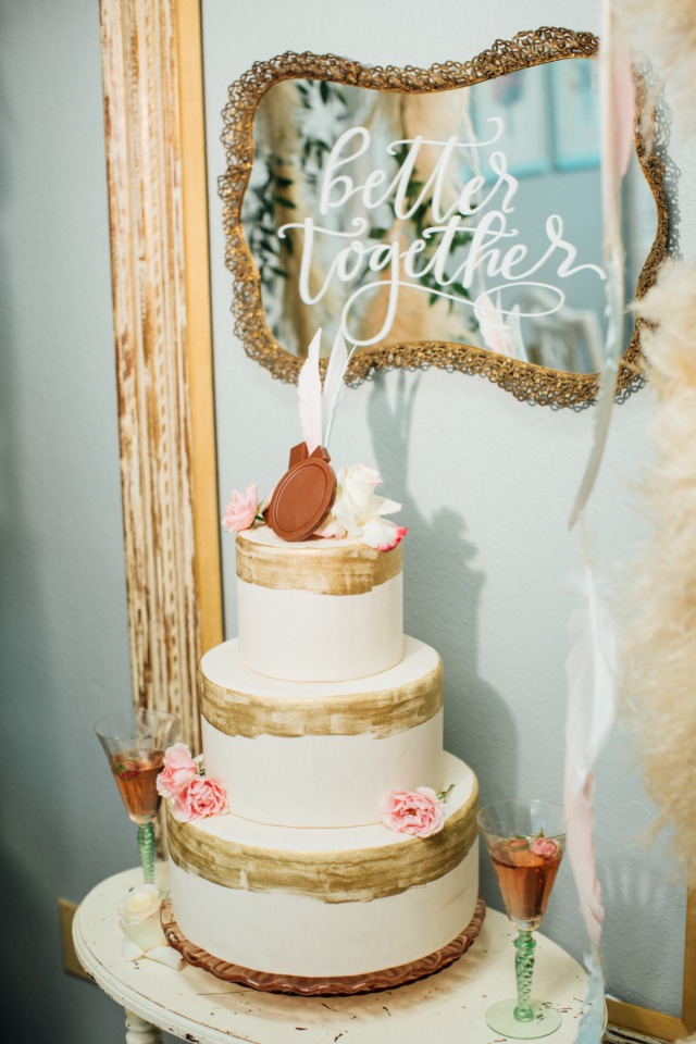 three tiered wedding cake with xo chocolate cake topper